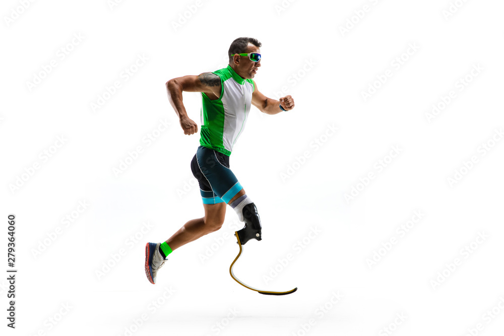 Obraz premium Athlete with disabilities or amputee isolated on white studio background. Professional male runner with leg prosthesis training and practicing in studio. Disabled sport and healthy lifestyle concept.
