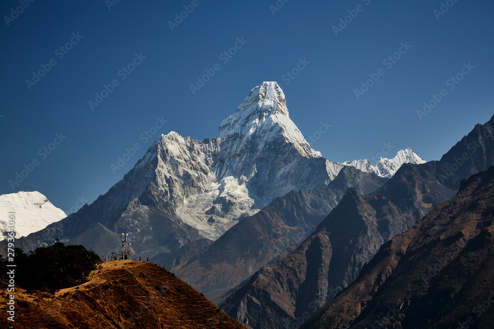 The Ama Dablam massif against the blue sky on beautiful sunny day.