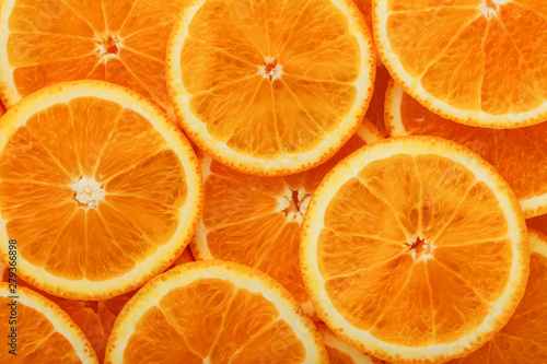 Round orange slices, in the form of texture and lanterns of fresh juicy slices