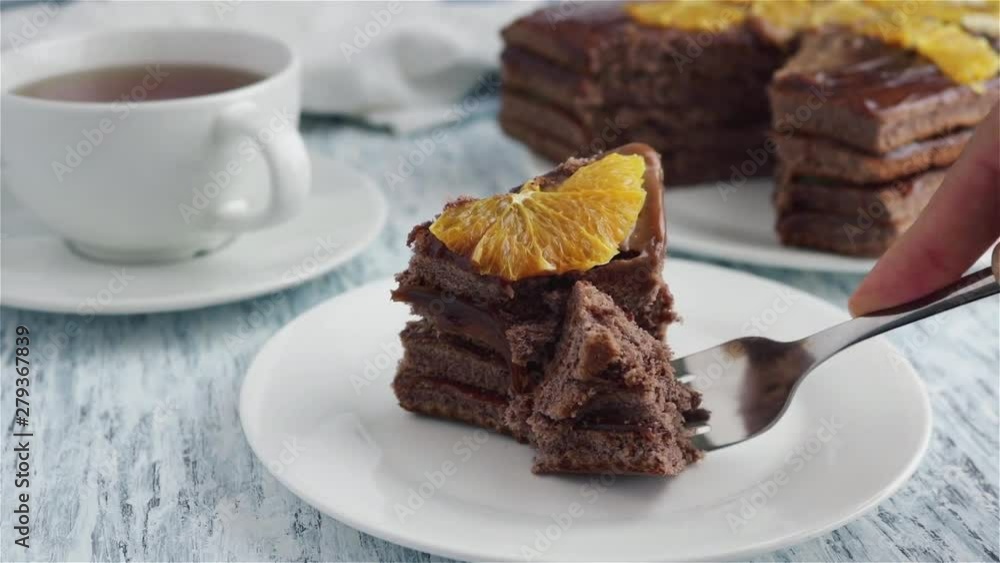 woman eat chocolate cake with fork close up woman eat chocolate cake with fork close up