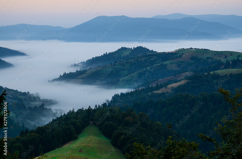 Fog in autumn, the mountains of the Carpathians in Ukraine