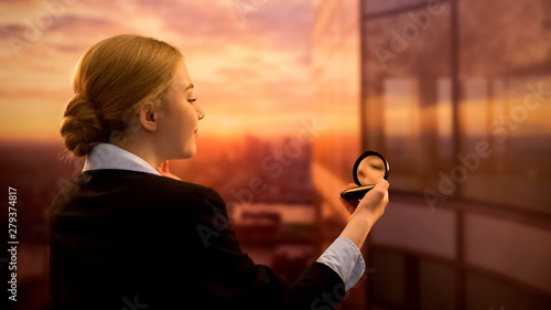 Fotografija Beautiful stewardess looking at mirror before flight, beauty tips, cosmetics