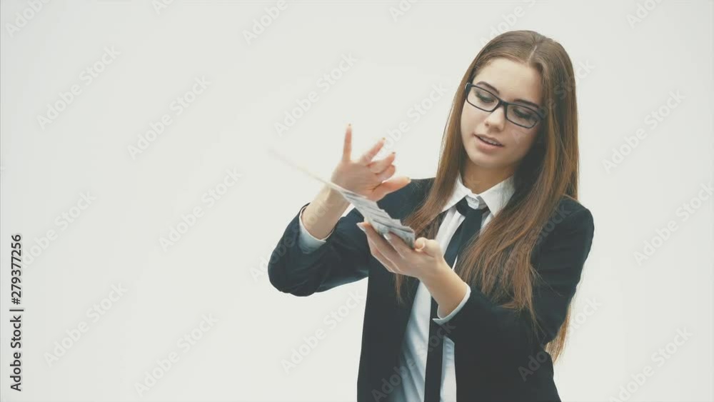 Beautiful young business woman wearing a large black jacket and chenille glasses. Beautiful young business woman wearing a large black jacket and chenille glasses.