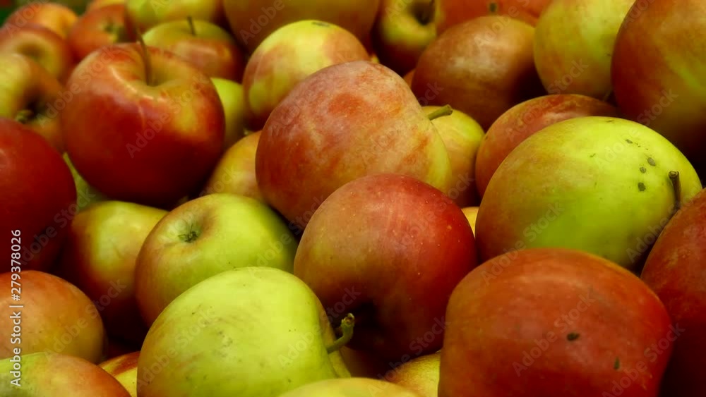 Apples in the store. Ripe fresh red apples on sale at the market in the grocery store, in the department of fruits and vegetables. They lie in boxes in front of the buyer. Closeup. Healthy food. Apples in the store. Ripe fresh red apples on sale at the market in the grocery store, in the department of fruits and vegetables. They lie in boxes in front of the buyer. Closeup. Healthy food.