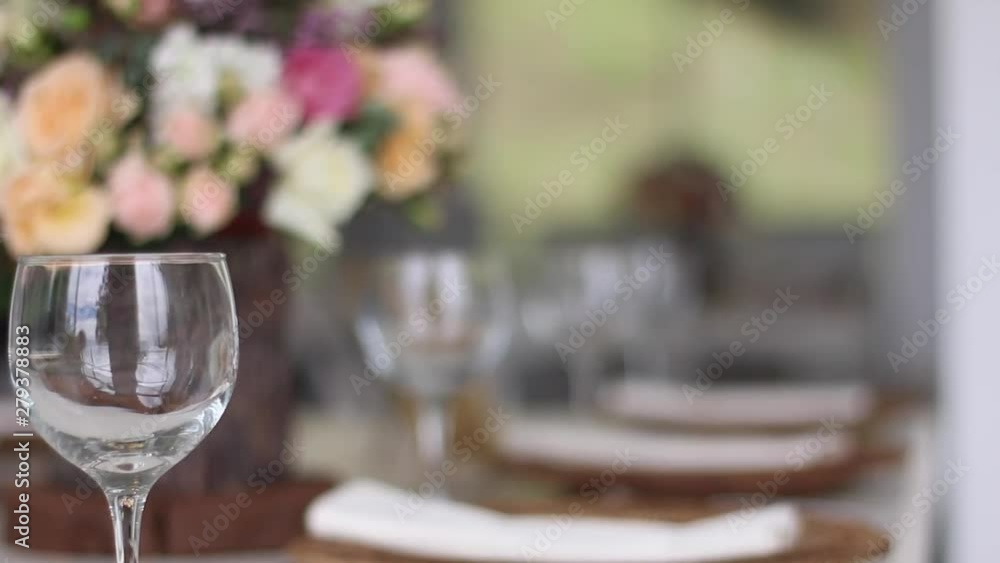 table in a Wedding before guest arrive, and uses fine cutlery, glasses.and flowers. Concept of: catering, design, romantic dinners table in a Wedding before guest arrive, and uses fine cutlery, glasses.and flowers. Concept of: catering, design, romantic dinners