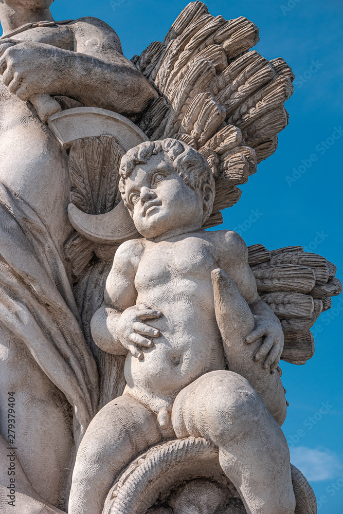 Sculpture of farmer and his scholar on Zoll Bridge in Magdeburg downtown, Germany, sunny day, blue sky