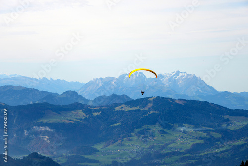 paraglider in the alps with panorama of Montafon mountains