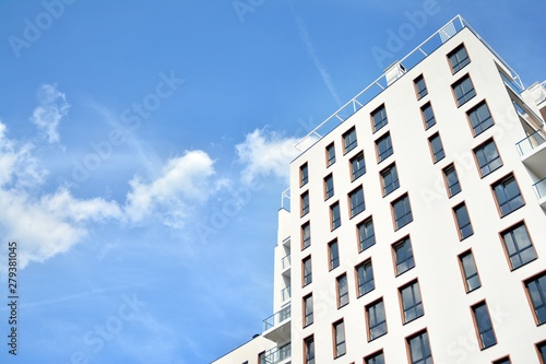 Multistory new modern apartment building. Stylish living block of flats.