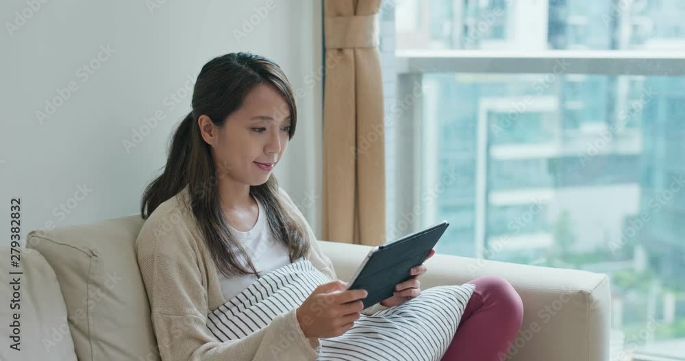 Woman watch on tablet at home Woman watch on tablet at home