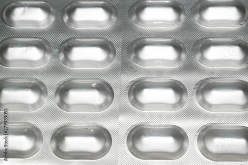 Tablets capsules in silver packaging pills for medicine design background