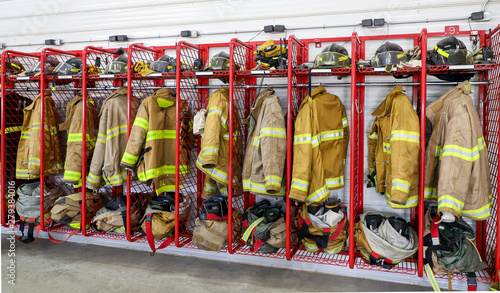 Fényképezés A horizontal photo of firemen uniforms hanging in there locker.