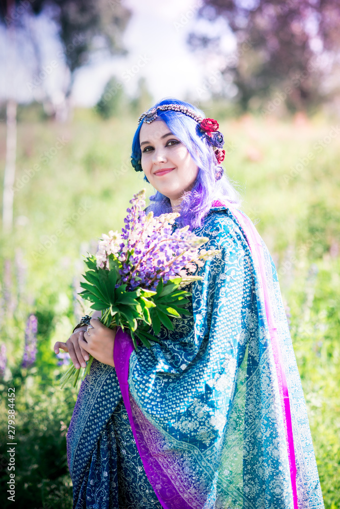 Girl in a sari in lupins
