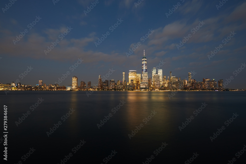 Cityscape of downtown Manhattan, New York, seen at dusk. Photographed Summer, 2019.