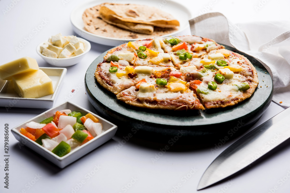 Chapati Pizza made using leftover Roti / Paratha with Cheese, vegetables, paneer and Sausage Chapati Pizza made using leftover Roti / Paratha with Cheese, vegetables, paneer and Sausage