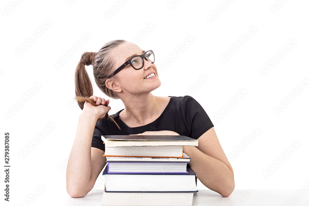Smiling teen girl with books at table, isolated Smiling teen girl with books at table, isolated