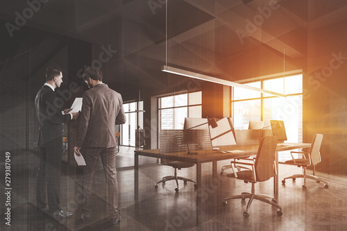 Businessmen in gray office interior