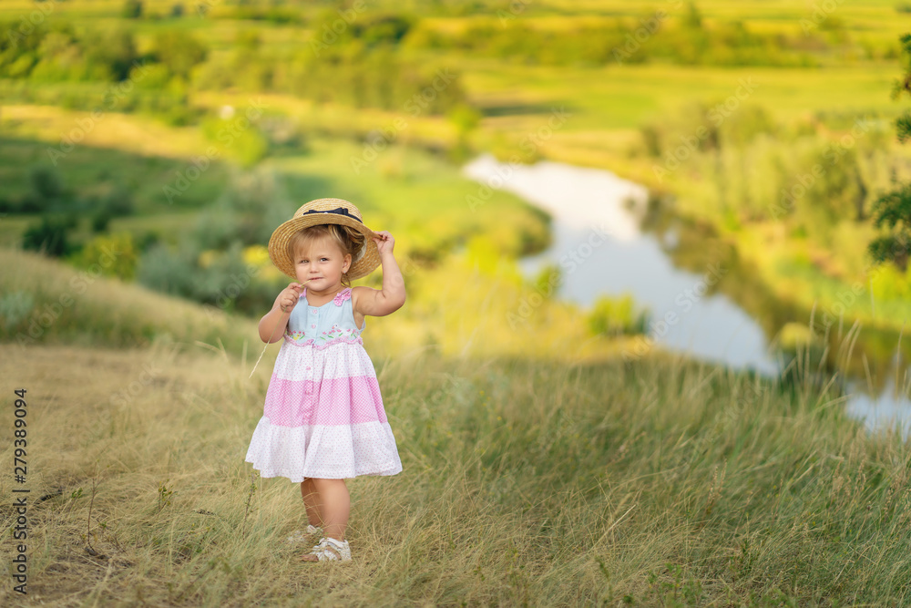 little girl with hat in a field little girl with hat in a field
