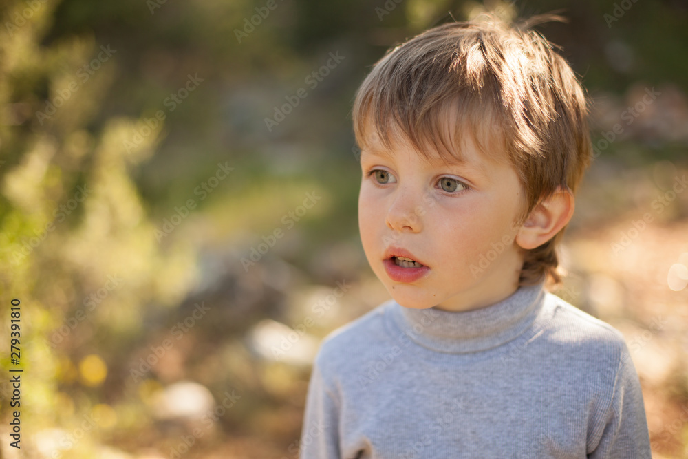 beautiful portrait of a baby boy smiling in nature for a walk beautiful portrait of a baby boy smiling in nature for a walk