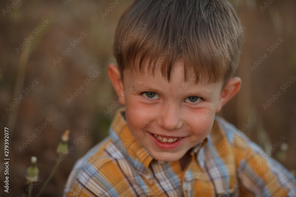 beautiful portrait of a baby boy smiling in nature for a walk beautiful portrait of a baby boy smiling in nature for a walk
