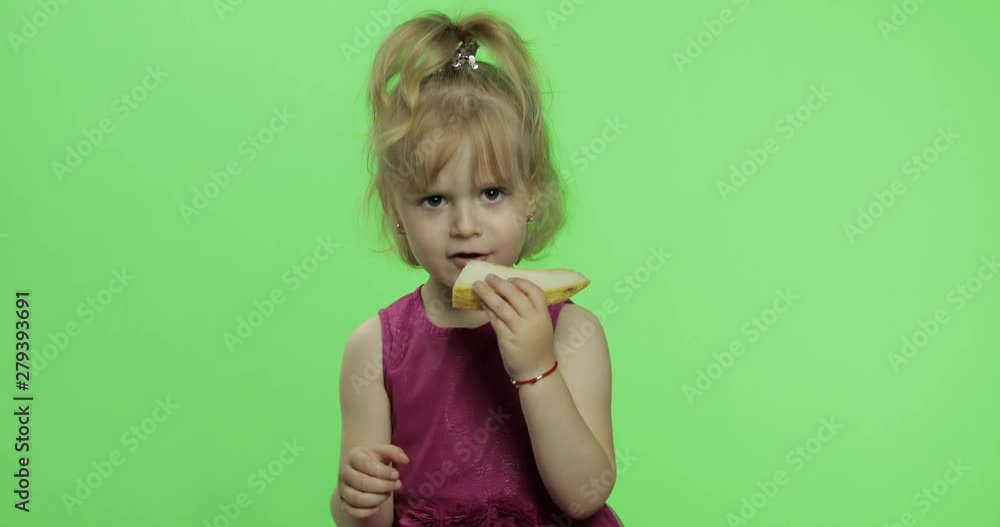 Girl in purple dress eating melon. Happy four years old child. Chroma Key Girl in purple dress eating melon. Happy four years old child. Chroma Key