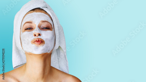 Photographie Beautiful young woman with facial mask on her face