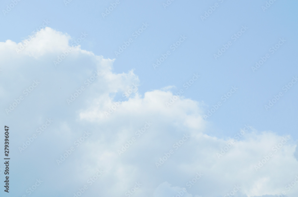 Blue sky with white clouds. Heavenly clear background.