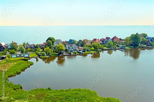 Aerial from the traditional village Uitdam at the IJsselmeer in the Netherlands photo