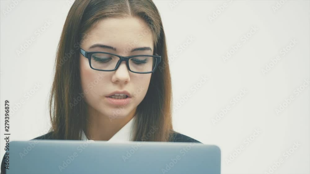 Woman using a digital tablet PC happy isolated on a white background. Focus on both the tablet and the work of the business. Woman using a digital tablet PC happy isolated on a white background. Focus on both the tablet and the work of the business.