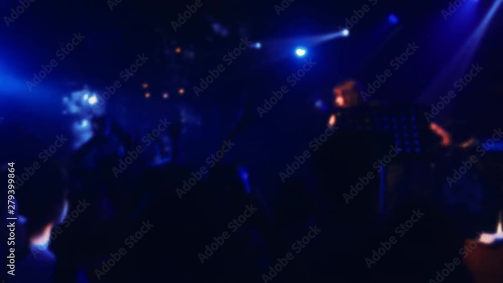Crowd teamwork blurred background people at a rock concert concept. party light effects lifestyle in dance club blur background Crowd teamwork blurred background people at a rock concert concept. party light effects lifestyle in dance club blur background