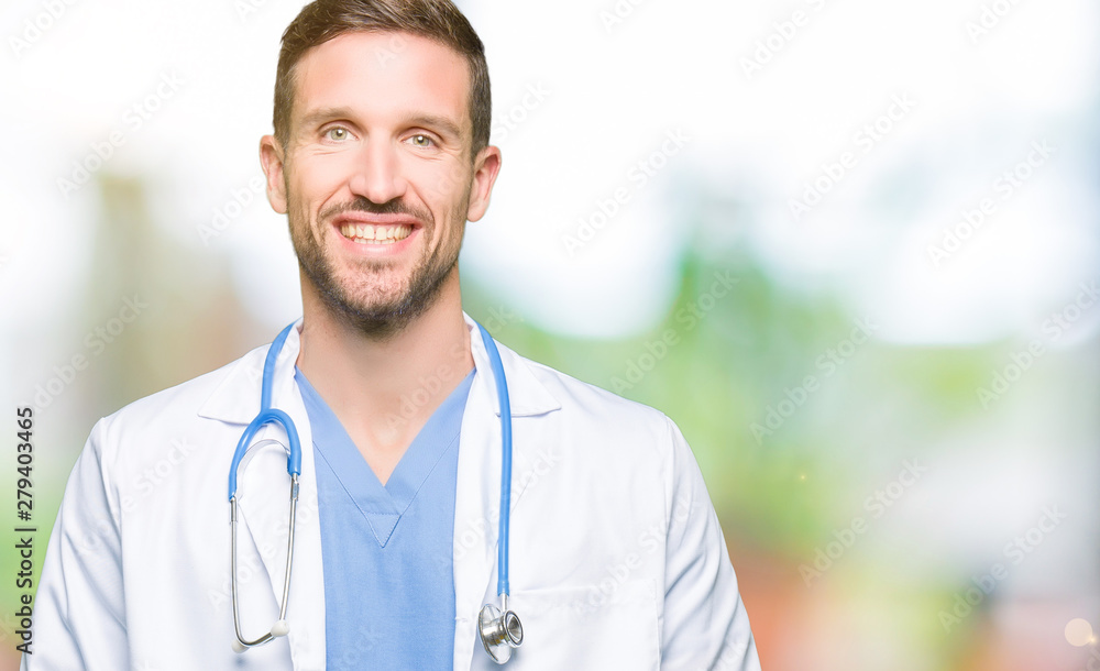 Handsome doctor man wearing medical uniform over isolated background with a happy and cool smile on face. Lucky person. Handsome doctor man wearing medical uniform over isolated background with a happy and cool smile on face. Lucky person.