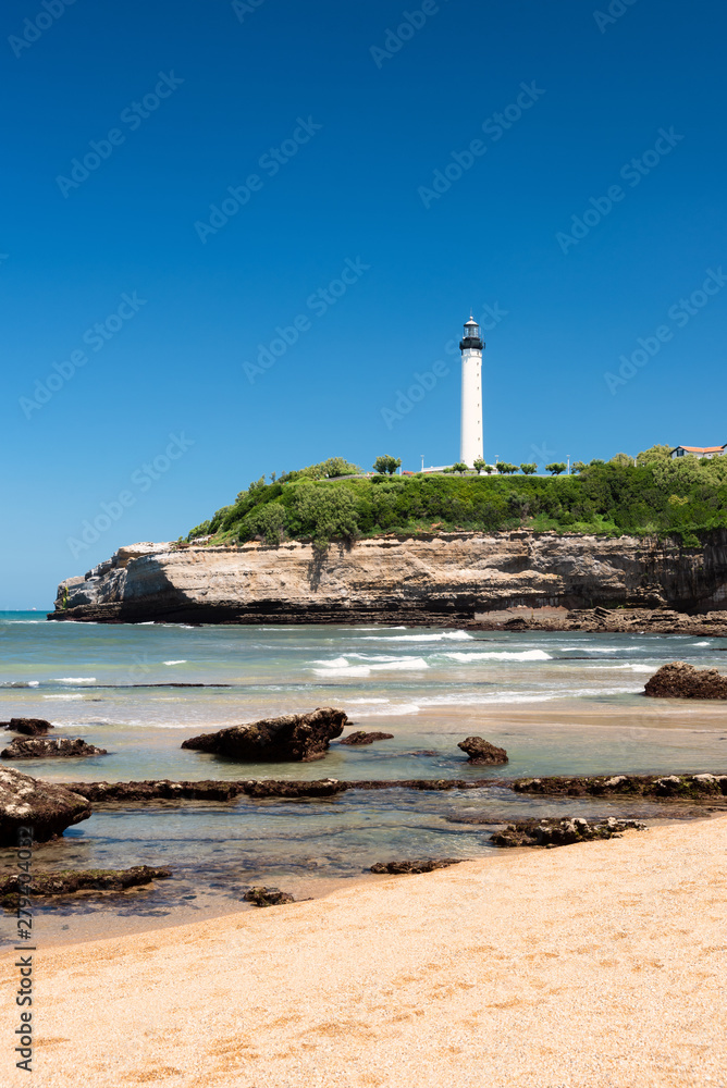 Amazing beach in Biarritz with the lighthouse in the background. Summer time on the Basque coast of France.