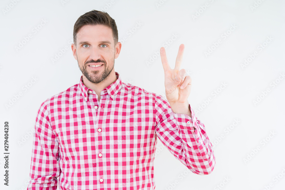 Young handsome man wearing shirt over isolated background showing and pointing up with fingers number two while smiling confident and happy. Young handsome man wearing shirt over isolated background showing and pointing up with fingers number two while smiling confident and happy.