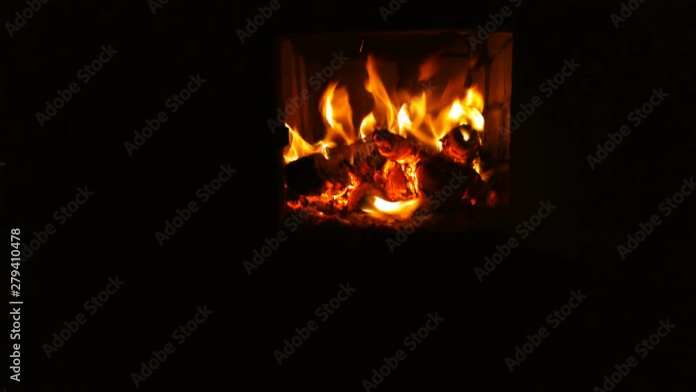 Fire burning in fireplace. Fireplace full of fire wood and fire Fire burning in fireplace. Fireplace full of fire wood and fire