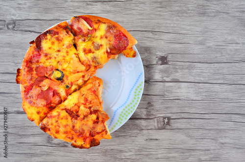 Cheese pizza on wooden  background
