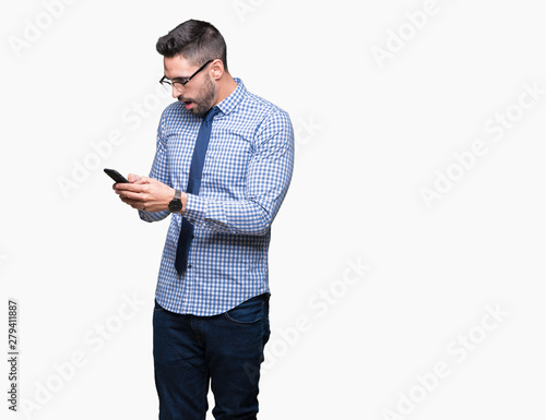 Young business man using smartphone over isolated background scared in shock with a surprise face, afraid and excited with fear expression