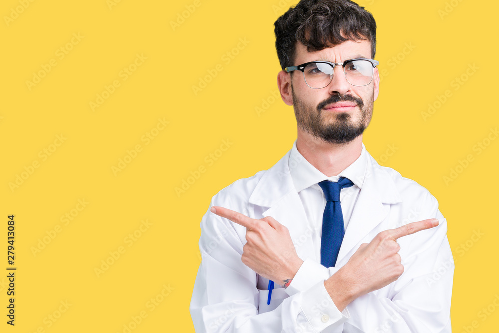 Young professional scientist man wearing white coat over isolated background Pointing to both sides with fingers, different direction disagree Young professional scientist man wearing white coat over isolated background Pointing to both sides with fingers, different direction disagree