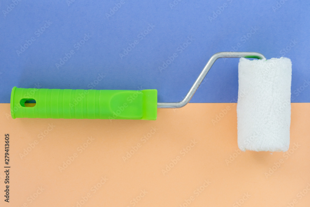 Obraz premium Painting roller on colorful background. Preparation for repair