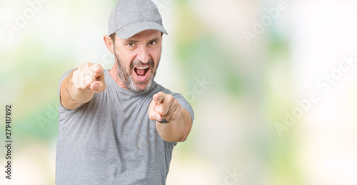 Handsome middle age hoary senior man wearing sport cap over isolated background Pointing to you and the camera with fingers, smiling positive and cheerful
