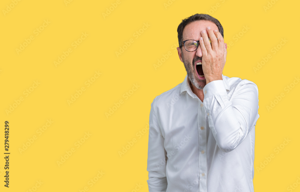 Handsome middle age elegant senior business man wearing glasses over isolated background Yawning tired covering half face, eye and mouth with hand. Face hurts in pain. Handsome middle age elegant senior business man wearing glasses over isolated background Yawning tired covering half face, eye and mouth with hand. Face hurts in pain.