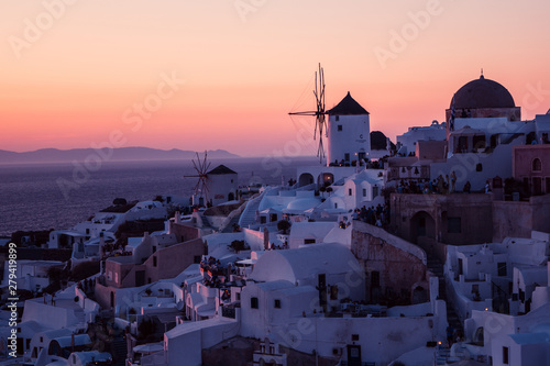 The white village of Oia, on the island of Santorini, Greece during a romantic red sunset in the evening.