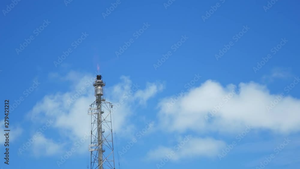 A gas flare at an oil refinery plant