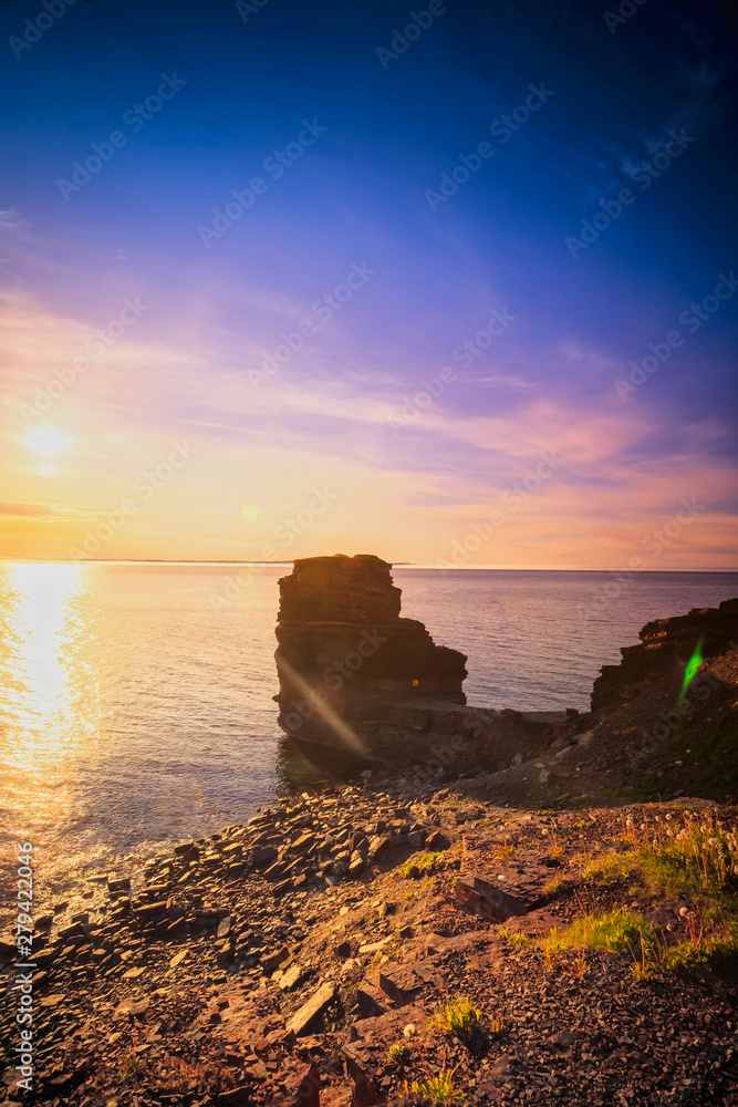 Obraz premium View of a beach at Bell Island, Newfoundland, Canada during sunset