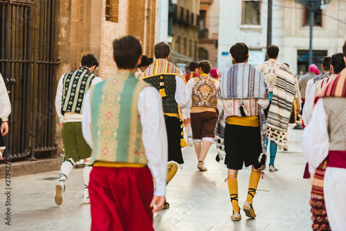 Valencia, Spain - March 17, 2019: Men Falleros dressed in the traditional Valencian costume during the party of Fallas in spring. photo