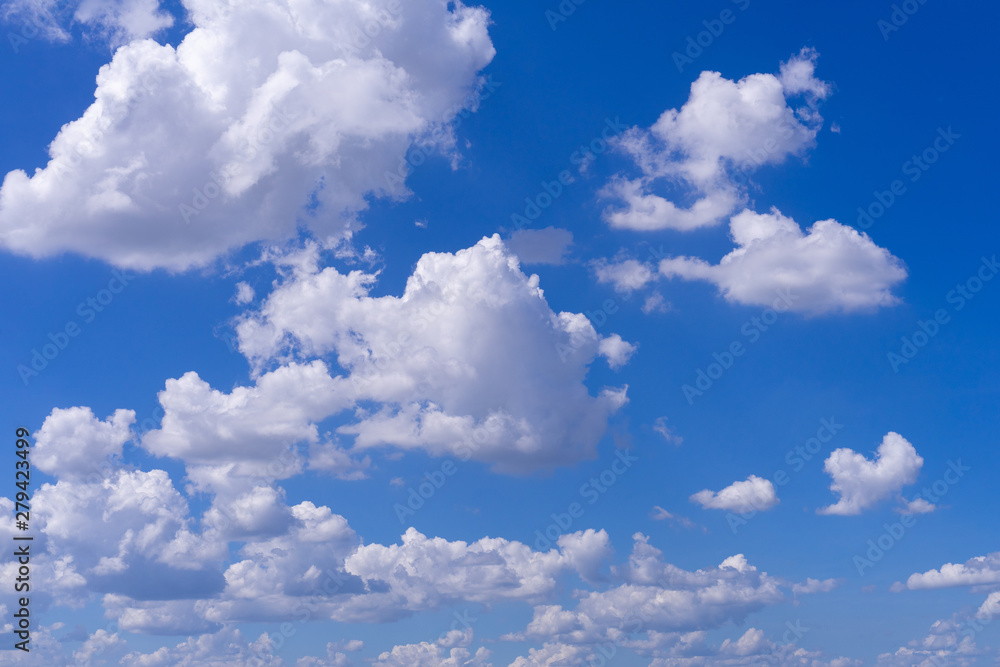 Light Stratocumulus clouds at deep blue sky.Natural sky background texture Light Stratocumulus clouds at deep blue sky.Natural sky background texture