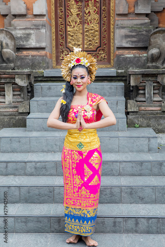 Balinese dancer shows welcome gesture in temple © Creativa Images
