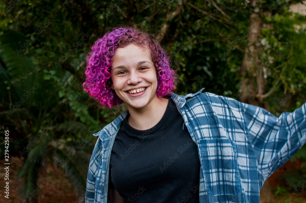 Fototapeta premium Young woman with colorful hair outdoors