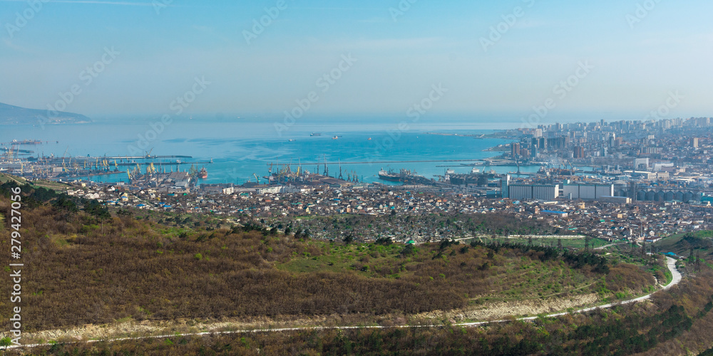 Panoramic view from the hill on the industrial town in the afternoon, the hero-city of Novorossiysk