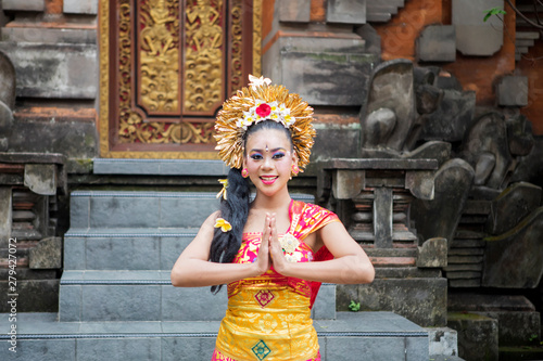 Friendly balinese dancer showing welcome gesture © Creativa Images