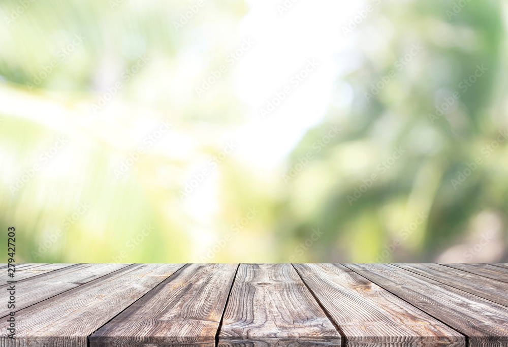 Abstract spring or summer with bokeh background and wood table Abstract spring or summer with bokeh background and wood table