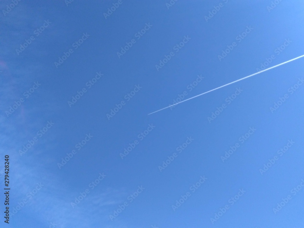 background blue sky and aircraft jet trail with space to write background blue sky and aircraft jet trail with space to write